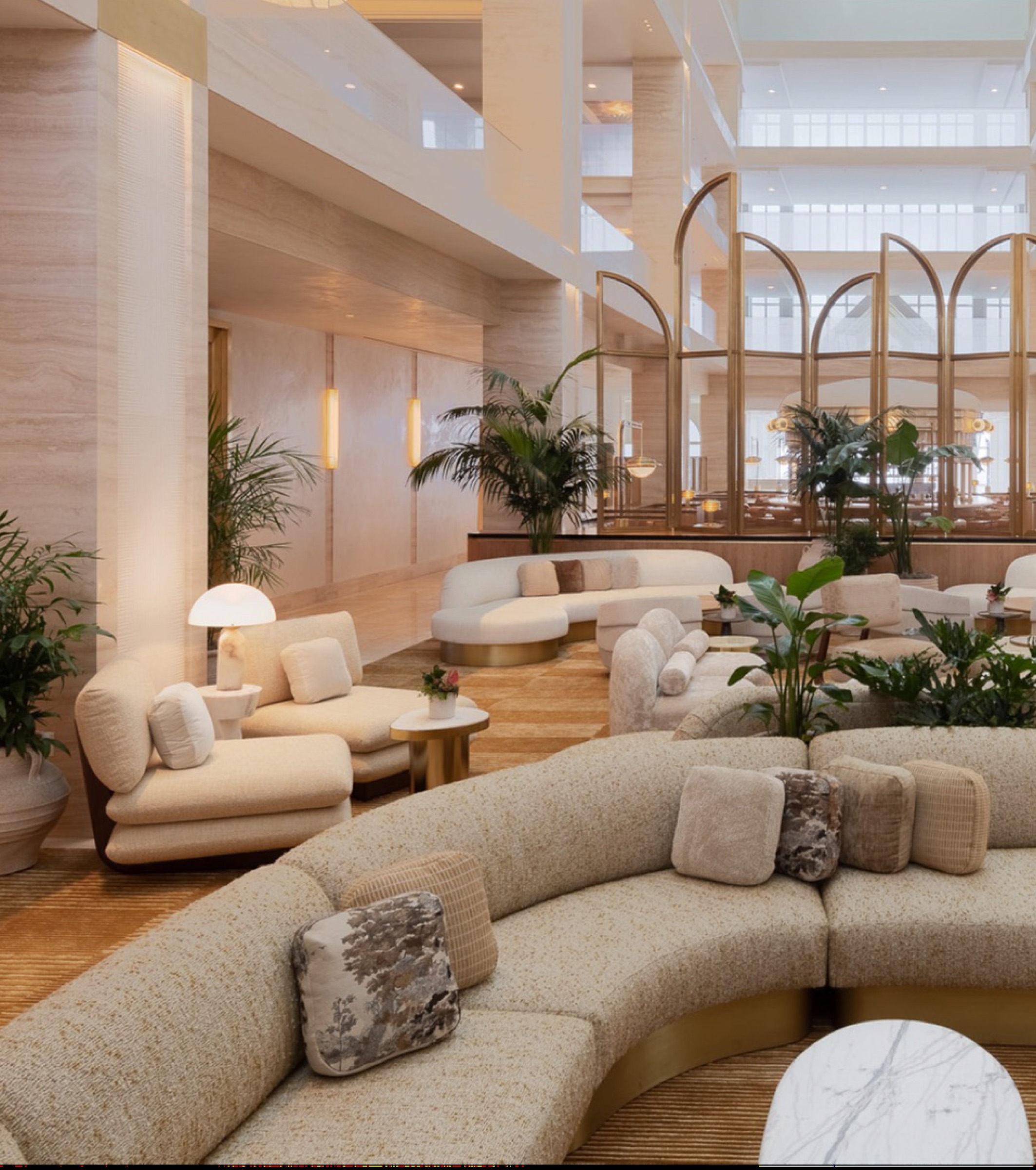 Natural stone integrated throughout a refined large-scale interior